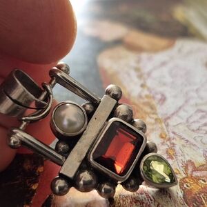 Intricate Silver and Red Necklace with Architectural Design